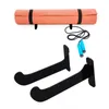 A yoga mat, jump rope, and two wall mounts are displayed against a white background. Podgląd zdjęcia produktu
