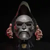 A person wearing a hooded robe is presenting a detailed replica of Doctor Doom's helmet. Anteprima dell’immagine prodotto