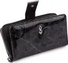 A black leather wallet with a butterfly embossed pattern. Produktbild-Vorschau