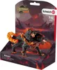 A toy dog figure in its packaging, with a fiery, volcanic background. Produktbild-Vorschau