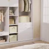 A white closet with clothes hanging and storage boxes. Produktbild-Vorschau