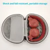 An open headphone case with red headphones inside. Produktbild-Vorschau