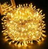 A tightly wound ball of yellow LED string lights, with a wooden frame and reflection visible in the background. Náhľad obrázku produktu