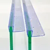 Close-up view of two shower door seals attached to glass panels, with water droplets on the seals. Produktbild-Vorschau