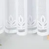 A close-up view of white lace curtains with a leaf pattern. Anteprima dell’immagine prodotto