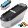 A product shot of a multi-functional grater with interchangeable blades. Náhled obrázku produktu