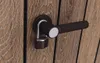 A close-up of a door handle with a padlock attached. Produktbild-Vorschau