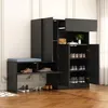 A black shoe cabinet with a built-in bench and blue cushion, shown in a room with wooden flooring and white paneled walls. Produktbild-Vorschau