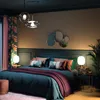 A bedroom scene with a bed, curtains, lamps, and decorative mirrors. Podgląd zdjęcia produktu