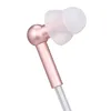 A close-up shot of a single in-ear headphone with a rose gold metallic finish and a white ear tip, isolated on a white background. Produktbild-Vorschau