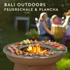 People are gathered around a fire pit in a backyard setting, with food being cooked on the grill. Produktbild-Vorschau