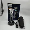 A Philips shaver and its accessories are displayed on a light gray background, with the product packaging visible. Podgląd zdjęcia produktu