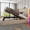 A bedroom with a bed that has its storage compartment open, revealing stored items. The bed has LED lighting on the headboard. Anteprima dell’immagine prodotto