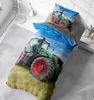 A bed with a duvet cover and pillow featuring a tractor print, set in a bedroom. Produktbild-Vorschau