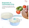 A cooking set with a frying pan and a pot, alongside fresh vegetables and a cutting board with meat, presented with marketing text about its grip. Náhled obrázku produktu