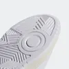 A close-up view of the sole of a white Adidas sneaker. Anteprima dell’immagine prodotto
