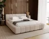A modern bedroom with a large, upholstered bed as the focal point. Náhled obrázku produktu