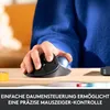 A person's hand is using a black trackball mouse on a wooden desk. There is a roll of yellow tape and a pen in the foreground. The person is wearing a blue sweater. Anteprima dell’immagine prodotto