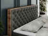 A close-up view of a tufted headboard of a bed, with pillows in the foreground. Produktbild-Vorschau