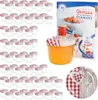 A collection of small glass jars with red and white checkered lids, a jar filled with orange jelly, a recipe booklet, and a decorative plate with a wooden and checkered heart design. Voir les images du produit