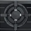 A close-up view of a gas burner on a stovetop. Produktbild-Vorschau