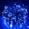 A close-up shot of a coiled string of blue LED lights. Produktbild-Vorschau