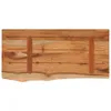 A top-down view of a wooden shelf with a live edge and two wooden supports. Anteprima dell’immagine prodotto