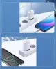 A white USB charger plugged into a power strip, connected to a smartphone that is charging. Náhled obrázku produktu