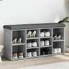 A shoe bench with multiple compartments filled with shoes, placed against a wall. Náhled obrázku produktu