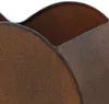 Close-up of the textured, rusty surface of a metal planter with a wavy edge. Voir les images du produit