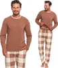 A man is shown wearing a two-piece pajama set. Produktbild-Vorschau