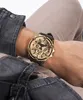 A close-up shot of a person's arm wearing a gold and black watch. Podgląd zdjęcia produktu