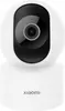 A white Xiaomi security camera is shown against a white background. Produktbild-Vorschau