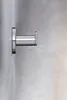 A close-up shot of a chrome towel hook mounted on a wall. Produktbild-Vorschau