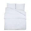 A white duvet cover and pillow set laid out flat. Náhľad obrázku produktu