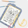 A coloring board with a drawing of a robot and rockets, with colored pencils. Produktbild-Vorschau