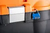 A close-up shot of a blue combination lock securing an orange and black toolbox. Produktbild-Vorschau