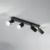 A black four-light ceiling spotlight fixture mounted on a white ceiling. Voir les images du produit