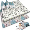 A baby is crawling on a play mat that is folded in half. The play mat has a colorful animal design. Voir les images du produit