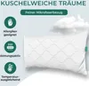 A white pillow with a wavy pattern is shown against a light gray background with clouds. Produktbild-Vorschau