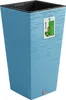 A blue textured planter pot with a tag attached. Voir les images du produit