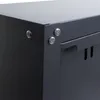 A close-up view of the corner of a dark gray metal cabinet, showing the rivets and a handle. Voir les images du produit