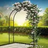 A rose-covered metal archway in a garden setting. Produktbild-Vorschau