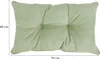 A light green cushion with dimensions indicated. Produktbild-Vorschau