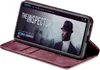 A smartphone in a burgundy flip case is displayed, showing a movie poster on its screen. Produktbild-Vorschau