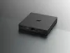 A black media streamer box with ports on the side, set against a gradient background. Anteprima dell’immagine prodotto