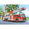 A fire engine with an extended ladder is parked on a road, with trees and a grassy area in the background. A firefighter is visible on the ladder. Podgląd zdjęcia produktu