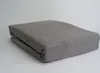 A folded gray fitted sheet is shown on a white background. Produktbild-Vorschau