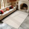 A living room scene with a sofa, fireplace, and a rug. Voir les images du produit