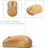 A collage of images showcasing a bamboo computer mouse, with text describing its ergonomic features and a diagram illustrating its shape. Produktbild-Vorschau